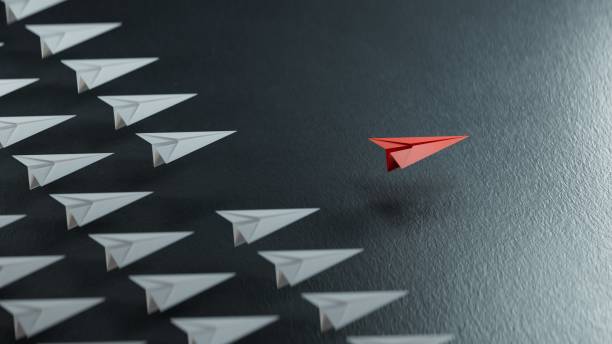 Different business concept.new ideas. paper art style. creative idea.red leader plane, standing out from the crowd of white planes.3D rendering on black background.