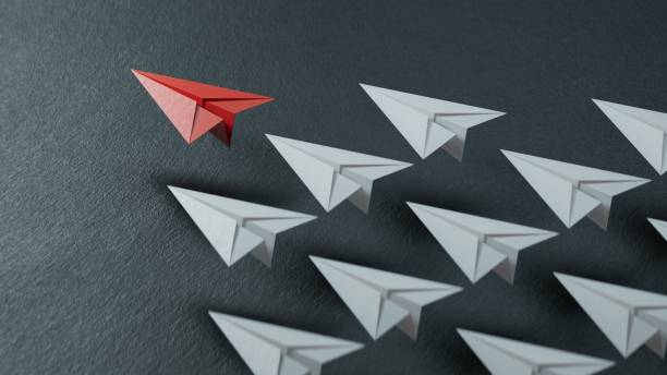 istock Different business concept.new ideas. paper art style. creative idea.Leaderplane concept, black leader plane leading white planes.3D rendering on black background. 2178163491