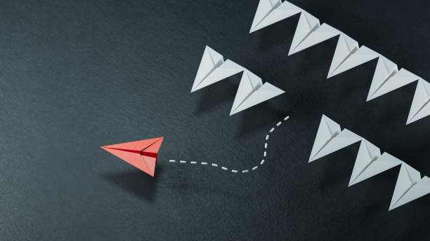 istock Different business concept.new ideas. paper art style. creative idea.Leaderplane concept using red paper plane among white planes.3D rendering on black background. 2178163547