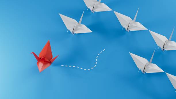 istock Different business concept.new ideas. paper art style. creative idea.Leaderswan concept using red paper swan among white swans.3D rendering on blue background. 2178163838