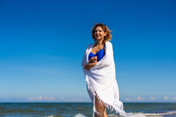 Mature woman enjoying vacation at the beach
