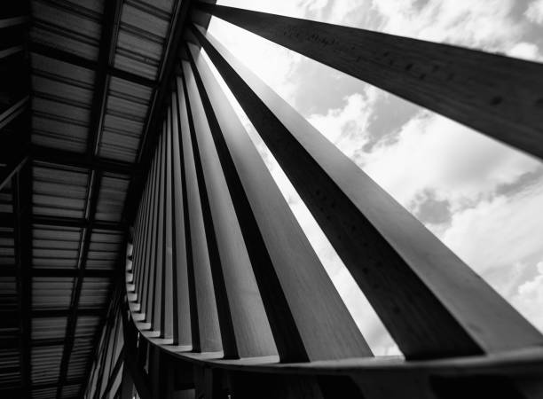 A structure featuring wooden slats on construction site contributing to its architectural style.