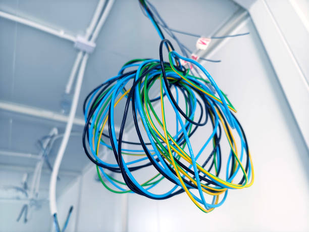 istock A collection of various wires is hanging down from the ceiling 2178166905