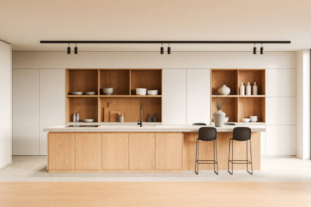 istock Beige home kitchen interior with bar island, cooking cabinet and kitchenware 2178169356