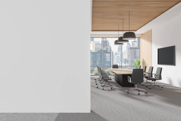 istock Meeting interior with table and armchairs, tv screen and window. Mockup wall 2178169637