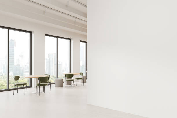 istock Empty office space with blank wall and modern furniture in front of large windows. 3D Rendering 2178169725