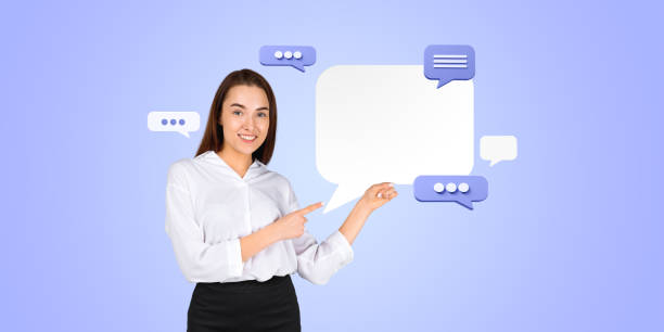 istock Smiling businesswoman finger point at mock up text message bubbles 2178169816