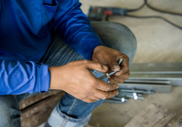 Asian male working in sculpting joss stick factory.