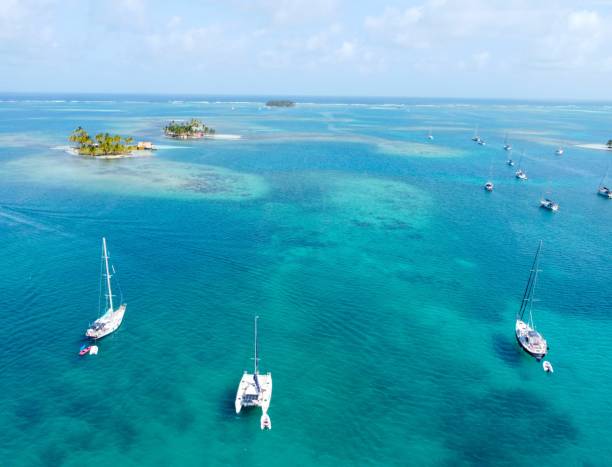 istock Boats in Crystal Clear Water With Tropical Islands 2178173680