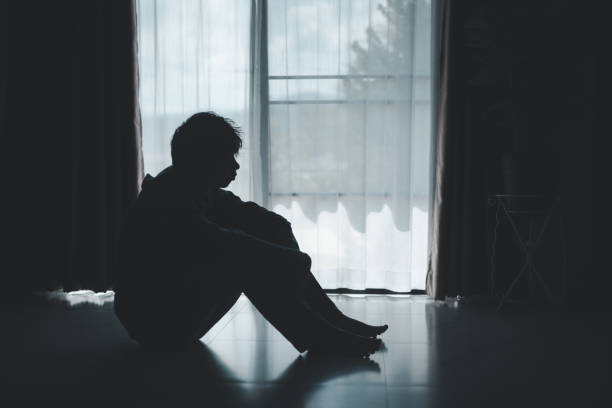 istock Silhouette of lost cast long shadow, embodying deep despair and hopelessness left him feeling perpetually stressed, sad, and unhappy. man sat alone, feeling weight of anxiety, stress, and depression. 2178173818
