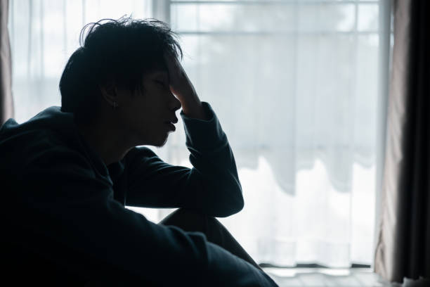 istock Silhouette of lost cast long shadow, embodying deep despair and hopelessness left him feeling perpetually stressed, sad, and unhappy. man sat alone, feeling weight of anxiety, stress, and depression. 2178173819