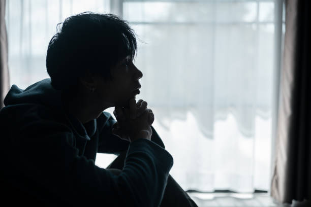 istock Silhouette of lost cast long shadow, embodying deep despair and hopelessness left him feeling perpetually stressed, sad, and unhappy. man sat alone, feeling weight of anxiety, stress, and depression. 2178173820