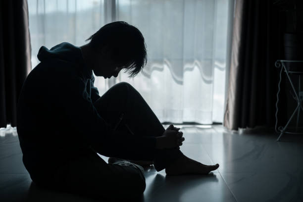istock Silhouette of lost cast long shadow, embodying deep despair and hopelessness left him feeling perpetually stressed, sad, and unhappy. man sat alone, feeling weight of anxiety, stress, and depression. 2178173823