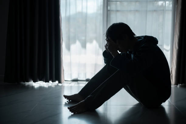 istock Silhouette of lost cast long shadow, embodying deep despair and hopelessness left him feeling perpetually stressed, sad, and unhappy. man sat alone, feeling weight of anxiety, stress, and depression. 2178173832