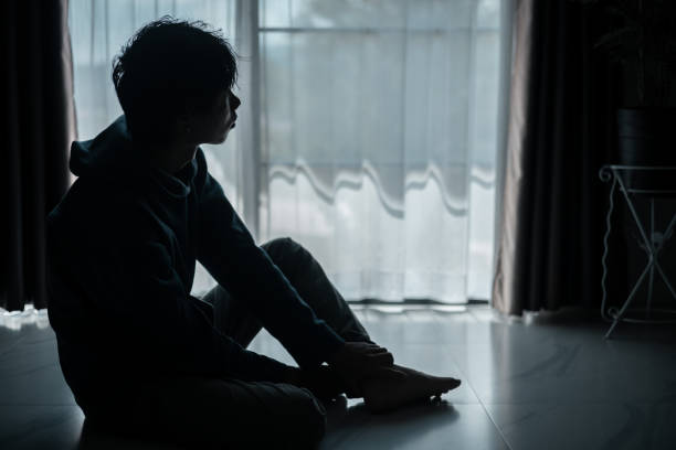 istock Silhouette of lost cast long shadow, embodying deep despair and hopelessness left him feeling perpetually stressed, sad, and unhappy. man sat alone, feeling weight of anxiety, stress, and depression. 2178173834