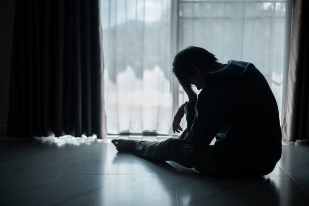 istock Silhouette of lost cast long shadow, embodying deep despair and hopelessness left him feeling perpetually stressed, sad, and unhappy. man sat alone, feeling weight of anxiety, stress, and depression. 2178173853