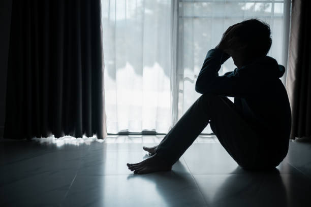 istock Silhouette of lost cast long shadow, embodying deep despair and hopelessness left him feeling perpetually stressed, sad, and unhappy. man sat alone, feeling weight of anxiety, stress, and depression. 2178173870