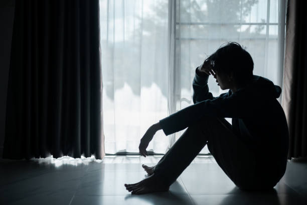 istock Silhouette of lost cast long shadow, embodying deep despair and hopelessness left him feeling perpetually stressed, sad, and unhappy. man sat alone, feeling weight of anxiety, stress, and depression. 2178173879