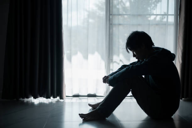 istock Silhouette of lost cast long shadow, embodying deep despair and hopelessness left him feeling perpetually stressed, sad, and unhappy. man sat alone, feeling weight of anxiety, stress, and depression. 2178173881
