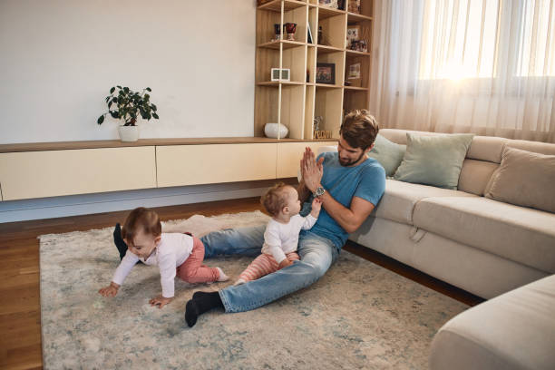 istock Young father with his twin girls 2178173931