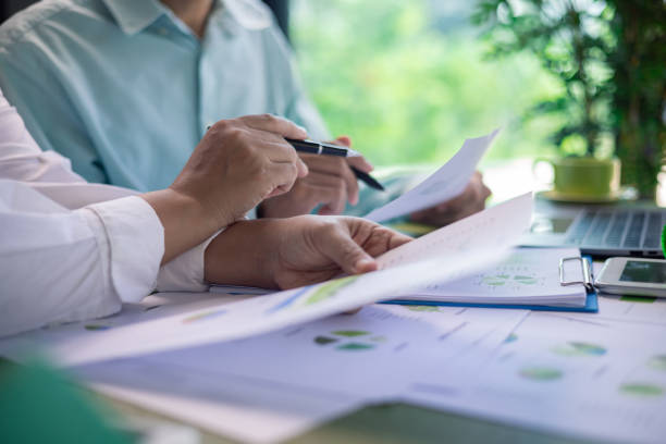 istock Analyzing green building performance metrics during business meeting. data analysis, green building, business meeting, sustainability, performance metrics, charts, graphs, real estate, eco-friendly. 2178174081