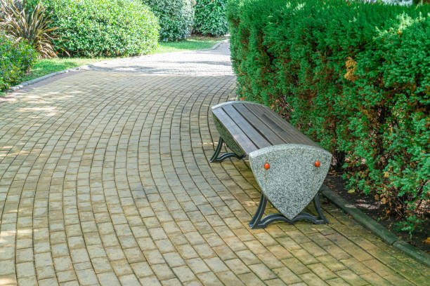 istock Modern bench design in a landscaped garden surrounded by greenery 2178174592