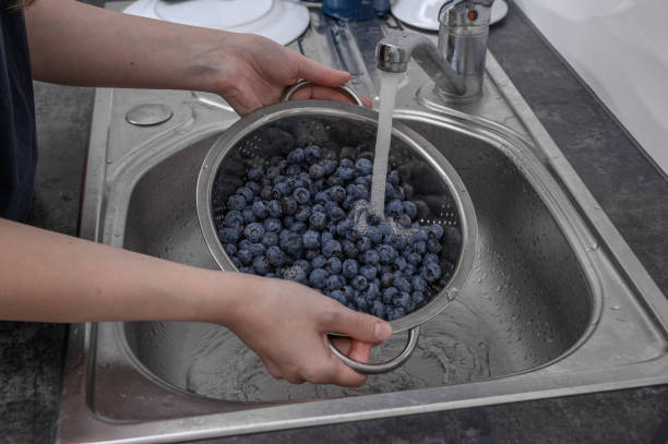 istock Blueberries washed with running tap water 2178174984