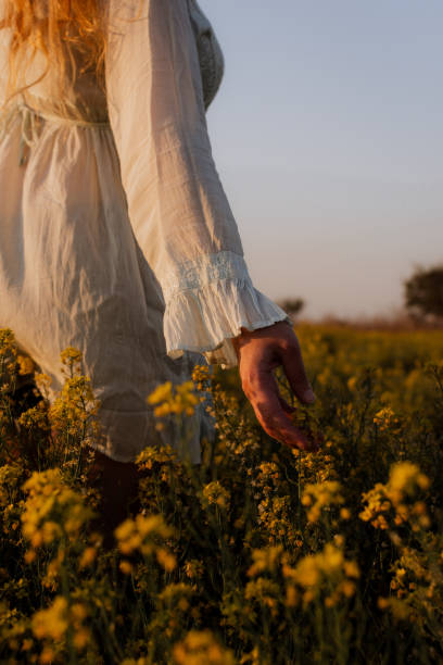 istock Girl and yellow flowers 2178175545