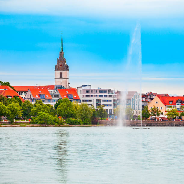 Sea fountain and St. Nicholas Church nikolaus in Friedrichshafen. Friedrichshafen is a city on the shore of Lake Constance or Bodensee in Bavaria, Germany.