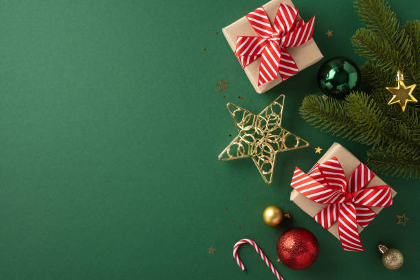istock Christmas gifts with red striped bows surrounded by festive decorations and pine branches on a green background create a joyful holiday atmosphere 2178175909