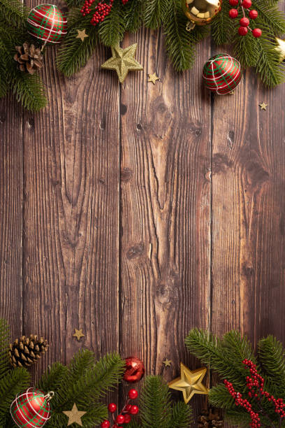 istock Rustic wooden vertical surface adorned with Christmas decorations including baubles, stars, and pine branches, creating a warm holiday atmosphere 2178175916