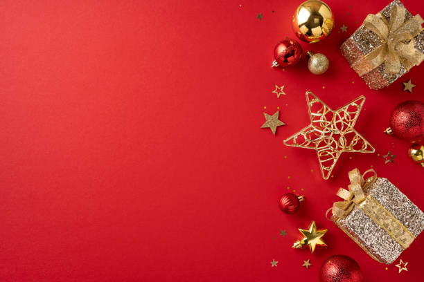istock Beautiful Christmas decorations and wrapped gifts placed on a vibrant red background, creating a festive atmosphere 2178175920