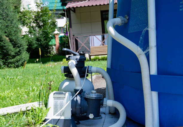 istock Close-up of a pool filtration system in a backyard garden. 2178176152