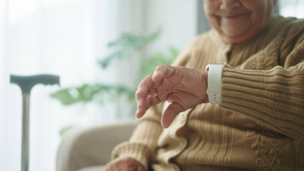 Elderly using smartwatch medical alert devices.