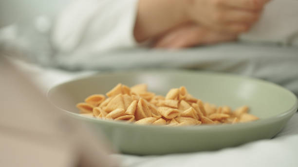 istock Woman relax watching movie while eating snacks. 2178177050