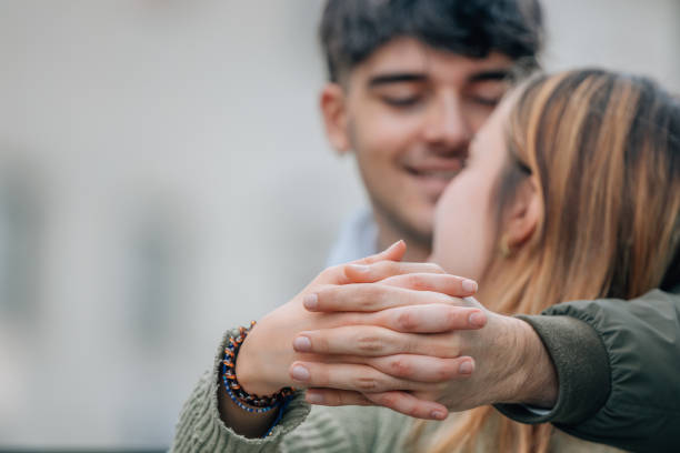 istock couple with hands clasped outdoors 2178181641