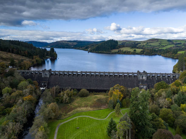 istock Large dam holding back water reservoir lake with dramatic sky 2178182179