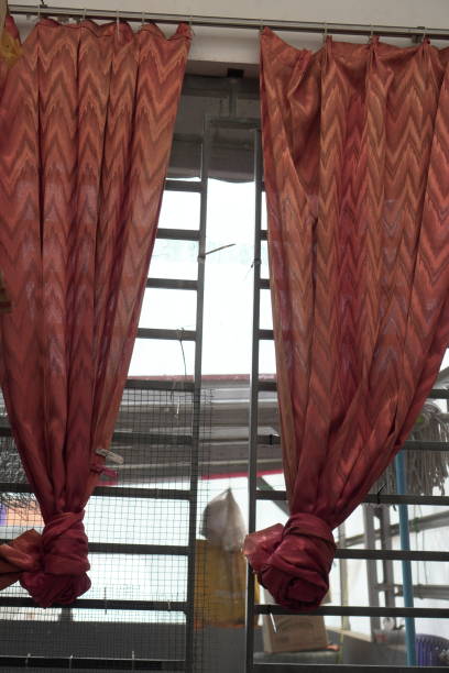 The interplay of light and shadow on tied curtains