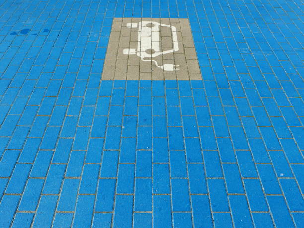 istock Pavement - surface of blue stones with sign for charging station 2178186312