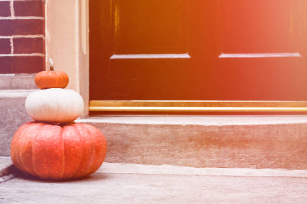 Pumpkins at the porch. Autumn, holiday season decorations.