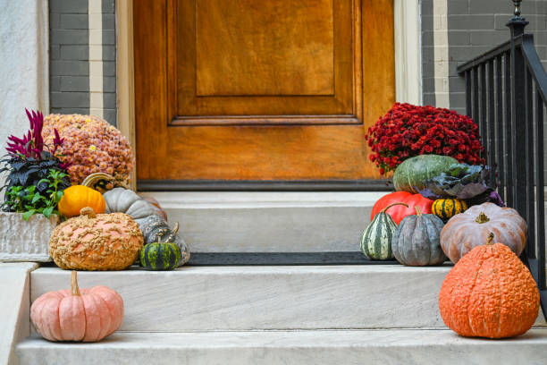 Pumpkins at the porch. Autumn, holiday season decorations.