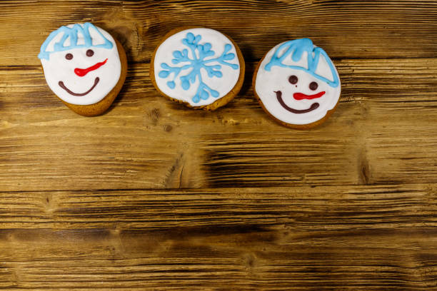 Christmas gingerbread cookies on a wooden background. Top view, copy space