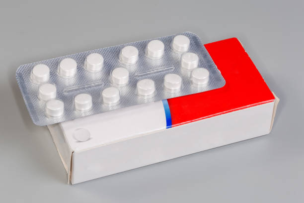 istock Blister of pills on its white-red cardboard box package 2178191654