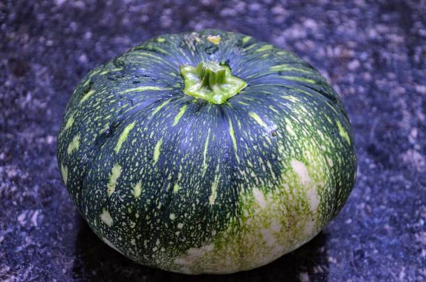 istock A pumpkin is also called pepper squash in the genus Cucurbita. Dark green skin and a pronounced acorn shape on fruits. Bright yellow flesh. Vegetable. Organic excellent food. Grown on vine plant. 2178192788