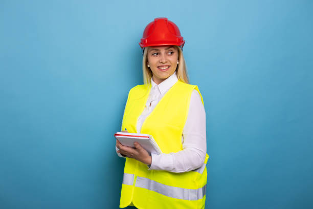 istock Smiling female construction engineer in a safety helmet 2178195271
