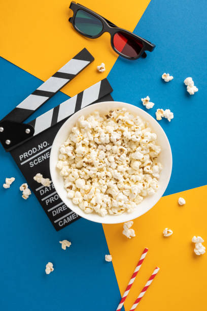 istock A vertical bowl of popcorn, 3D glasses, and a clapperboard on a colorful background creating a perfect cinema vibe for a relaxing autumn night 2178202459