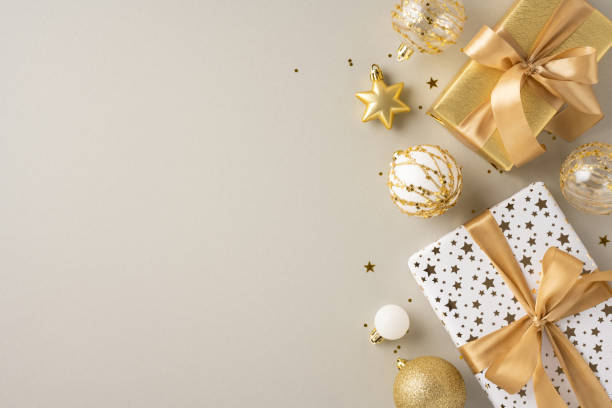 istock Luxurious Christmas presents wrapped in gold and white with elegant decorations. Perfect for celebrating the holiday season with style and sophistication 2178202464