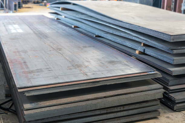 istock Carbon steel plates in the factory. Carbon steel is often divided into two main categories: low-carbon steel and high-carbon steel. 2178204708