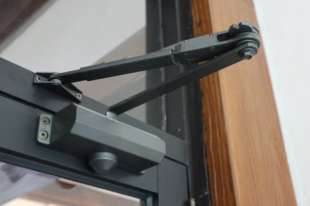 istock door closer. open closer on a glass door in the interior, a device for controlling the process of damping closing and opening, 2178204971