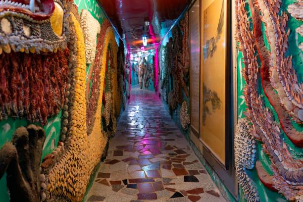 Colorful mosaic art hallway with intricate shell and tile designs, creating a vibrant and artistic atmosphere in Sanqing Sanyuan Palace Shell Temple